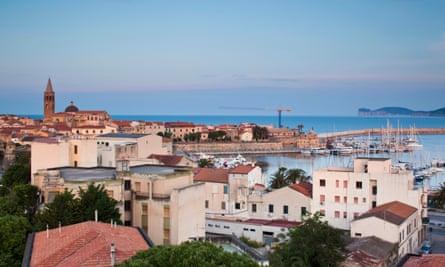 View of Alghero at dusk, Sassari Province, Sardinia, Italy